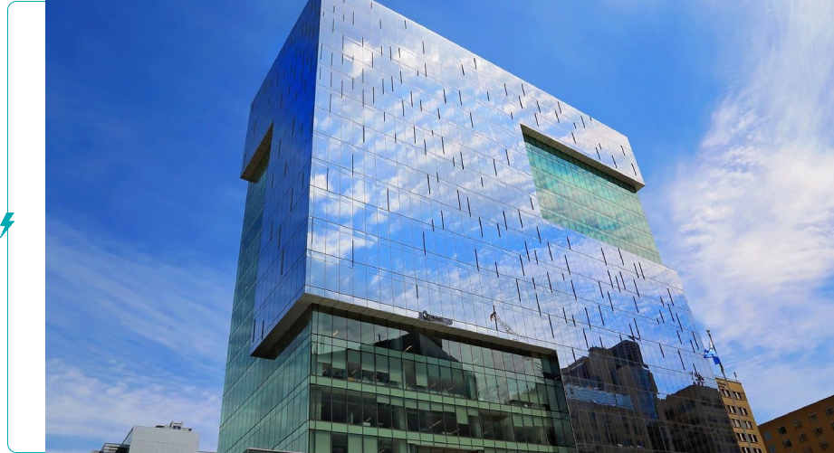 A building with a sky background and some clouds